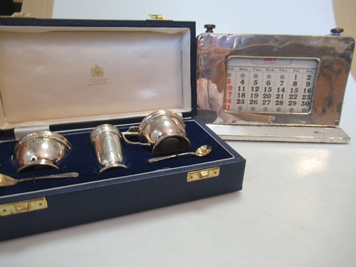 Lot 178 - A cased silver three piece cruet set together...