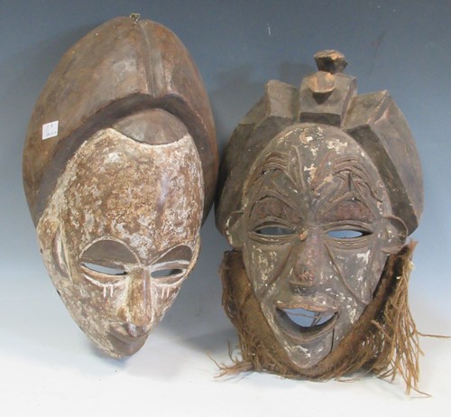 Lot 66 - Two modern carved African masks, largest 38cm...