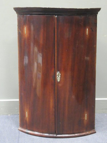 Lot 440 - A 19th century mahogany bow front corner...