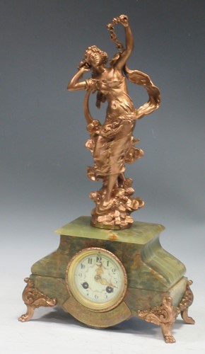 Lot 94 - An Art Nouveau onyx based figural gilt metal...