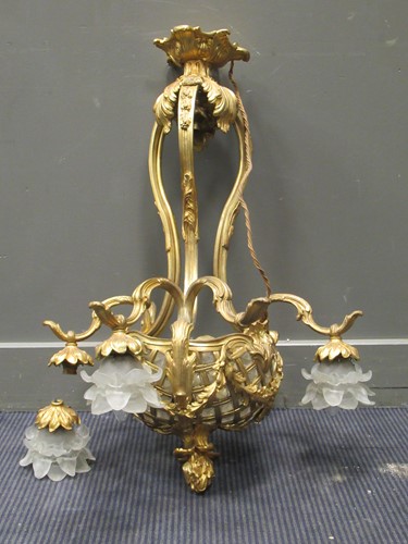 Lot 465 - A gilt metal and frosted glass chandelier,...