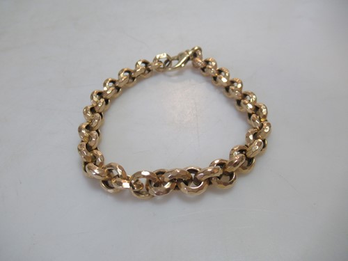Lot 159 - A faceted belcher link bracelet, stamped '585',...