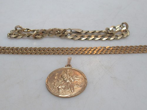 Lot 170 - A hallmarked 9ct gold St.Christopher, together...