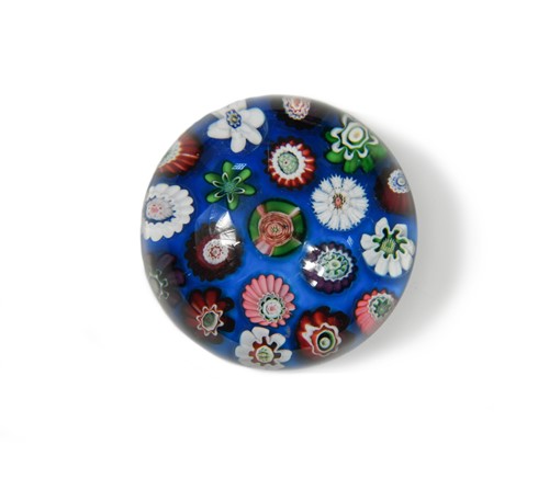 Lot 23 - A small Clichy spaced millefiori glass paperweight