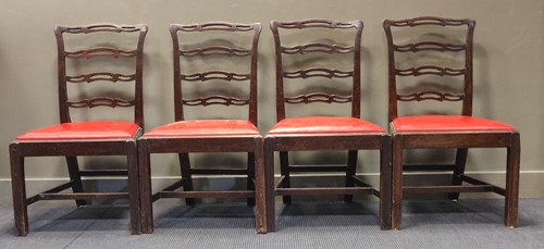 Lot 415 - A set of four George III style mahogany dining...