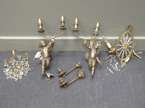 Lot 464 - Pair of gilt wall lights modelled as cherubs,...