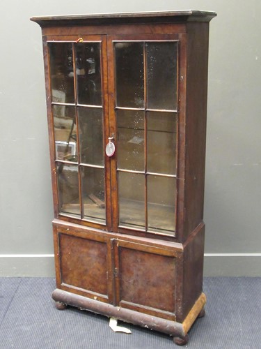 Lot 334 - A walnut revival glazed bookcase, 151.5 x 77 x...