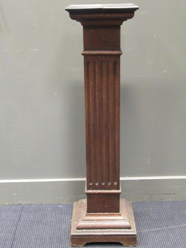 Lot 324 - A 20th century oak pedestal, the square top...