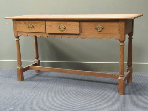 Lot 350 - An 18th century style pine three drawer...