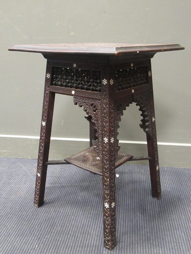 Lot 370 - A Moorish carved wood occasional table with...