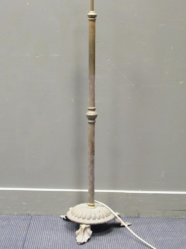 Lot 463 - A 20th century brass standard lamp raised on...