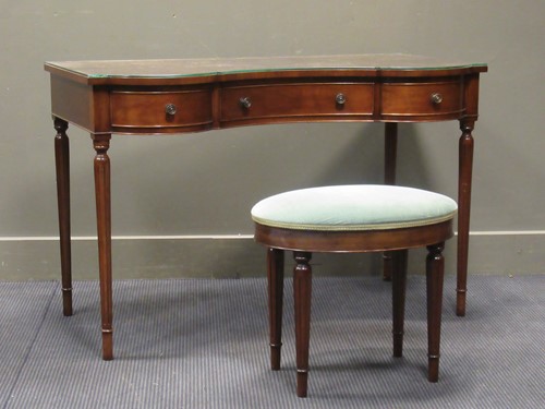 Lot 413 - A mahogany dressing table of serpentine form...