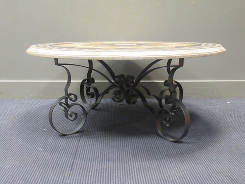 Lot 440 - A marble topped circular coffee table on...