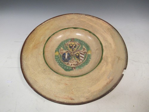 Lot 26 - A continental pottery plate, the centre...
