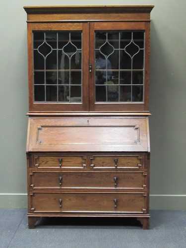 Lot 340 - Circa 1920, an oak lead glazed two door...