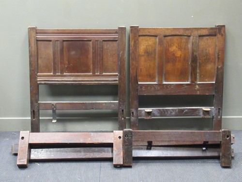 Lot 335 - Two similar oak single bedsteads with panelled...