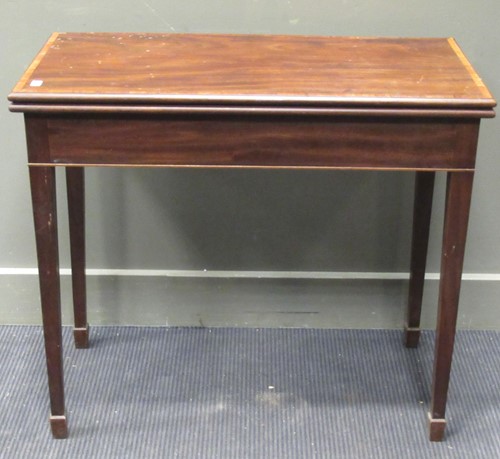 Lot 299 - A George III mahogany fold over tea table 74 x...