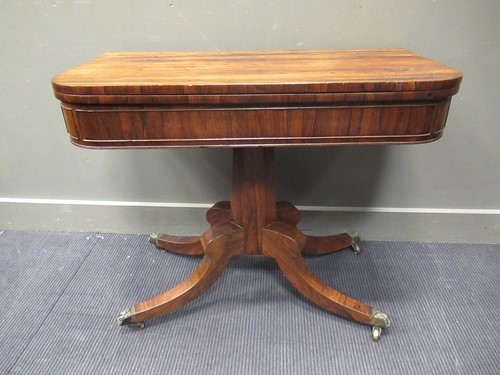 Lot 367 - A Regency rosewood card table on splayed legs,...