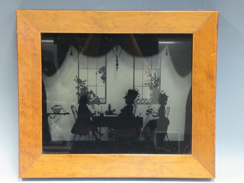 Lot 69 - A silhouette of a family group, 21 x 27cm