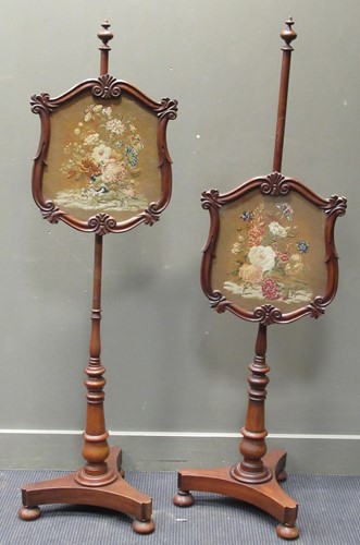 Lot 297 - A pair of 19th century needlework pole screens,...