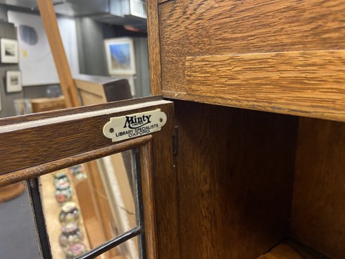 Lot 230 - An Art Deco sectional oak bookcase by Minty of Oxford