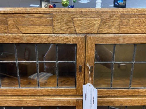 Lot 230 - An Art Deco sectional oak bookcase by Minty of Oxford