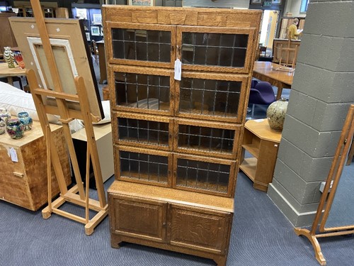 Lot 230 - An Art Deco sectional oak bookcase by Minty of Oxford