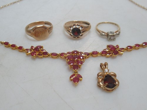 Lot 160 - Two hallmarked 9ct gold rings, and a ruby...