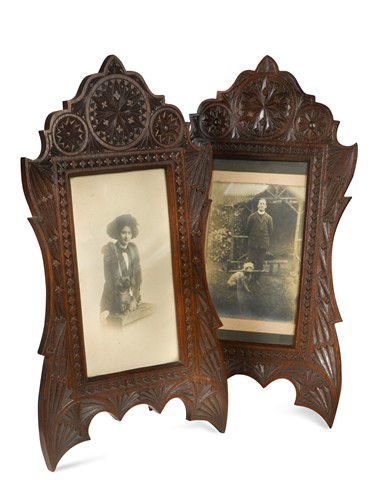 Lot 259 - A pair of chip carved hardwood easel-backed photograph frames, early 20th century