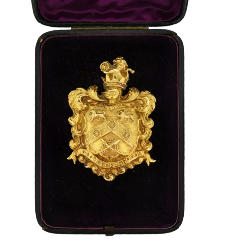 Lot 400 - An armorial gilt badge for the Wheelton family