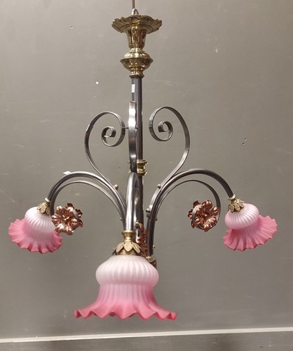 Lot 387 - A polished metal and glass three arm ceiling lamp