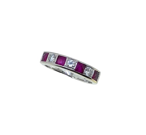 Lot 166 - A ruby and diamond half hoop ring