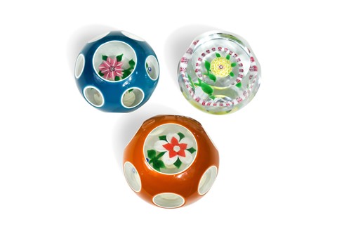 Lot 32 - A group of three John Deacons faceted glass paperweights