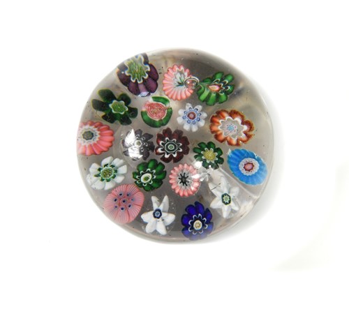 Lot 24 - A Clichy spaced millefiori glass paperweight