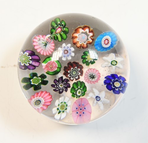 Lot 24 - A Clichy spaced millefiori glass paperweight