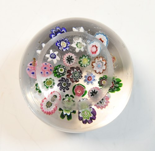 Lot 24 - A Clichy spaced millefiori glass paperweight