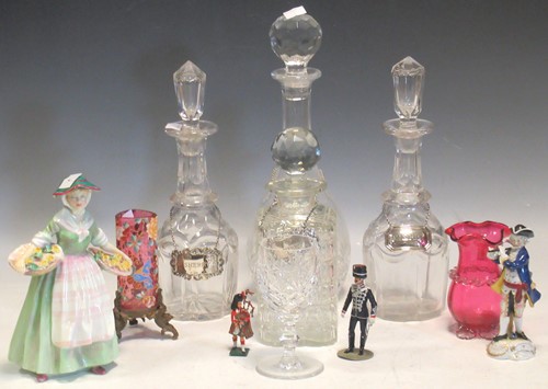 Lot 70 - Four decanters with labels, two cranberry...