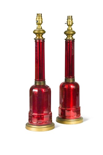 Lot 281 - A pair of cranberry glass table lamps