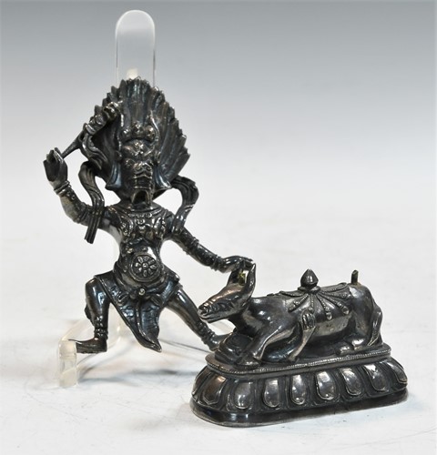 Lot 128 - A Tibetan white metal figure of Yama Dharmaraja, 19th/20th century