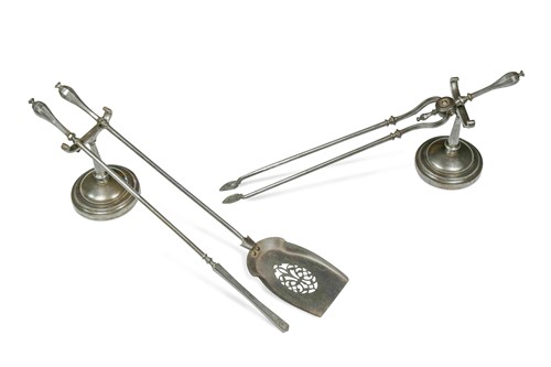 Lot 415 - A set of polished steel fire irons and matching fire dogs, circa 1800