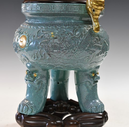 Lot 14 - A Chinese robin's egg glazed tripod censer, 18th/19th century