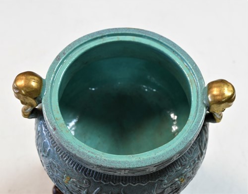 Lot 14 - A Chinese robin's egg glazed tripod censer, 18th/19th century