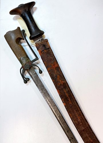 Lot 134 - A North African rhinoceros horn-handled sword, circa 19th century