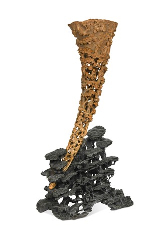 Lot 77 - A Chinese carved and pierced rhinoceros horn on stand, Qing Dynasty, circa 1880