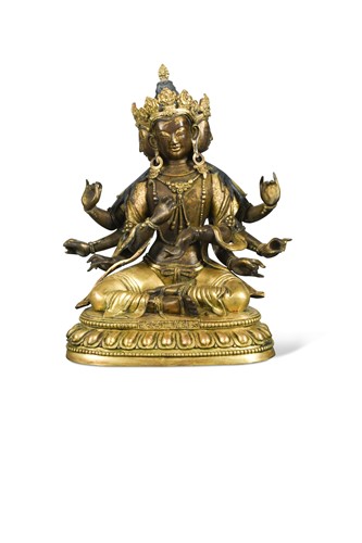 Lot 53 - A Chinese gilt bronze multi-headed and multi-armed seated Avalokitesvara