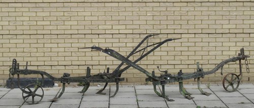 Lot 410 - Two ploughs, one stamped 'H45', 85 x 267cm and...