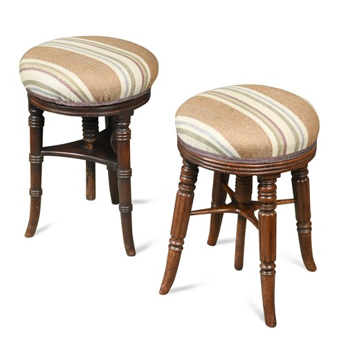 Lot 356 - A matched pair of Regency mahogany piano stools
