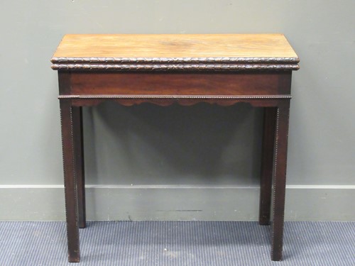 Lot 314 - An early George III mahogany tea table, with...