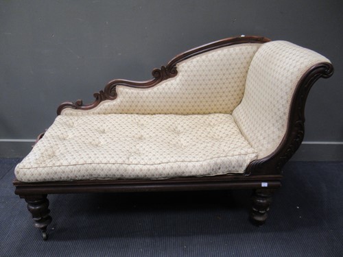 Lot 379 - A Victorian walnut small chaise longue on...