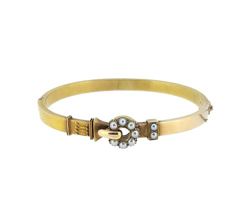 Lot 49 - A Victorian split pearl hinged bangle
